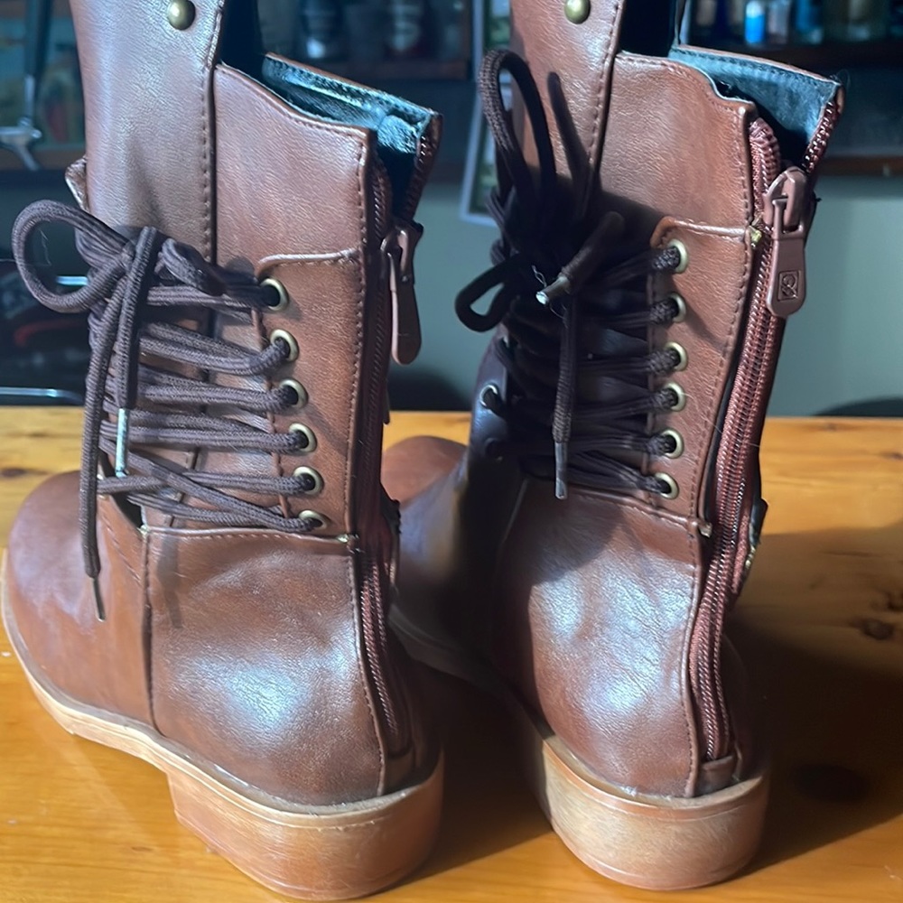 Brand new boots with lace up side and metal detailing
